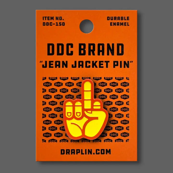 Draplin Design Company yellow and orange middle finger enamel pin on orange backing card