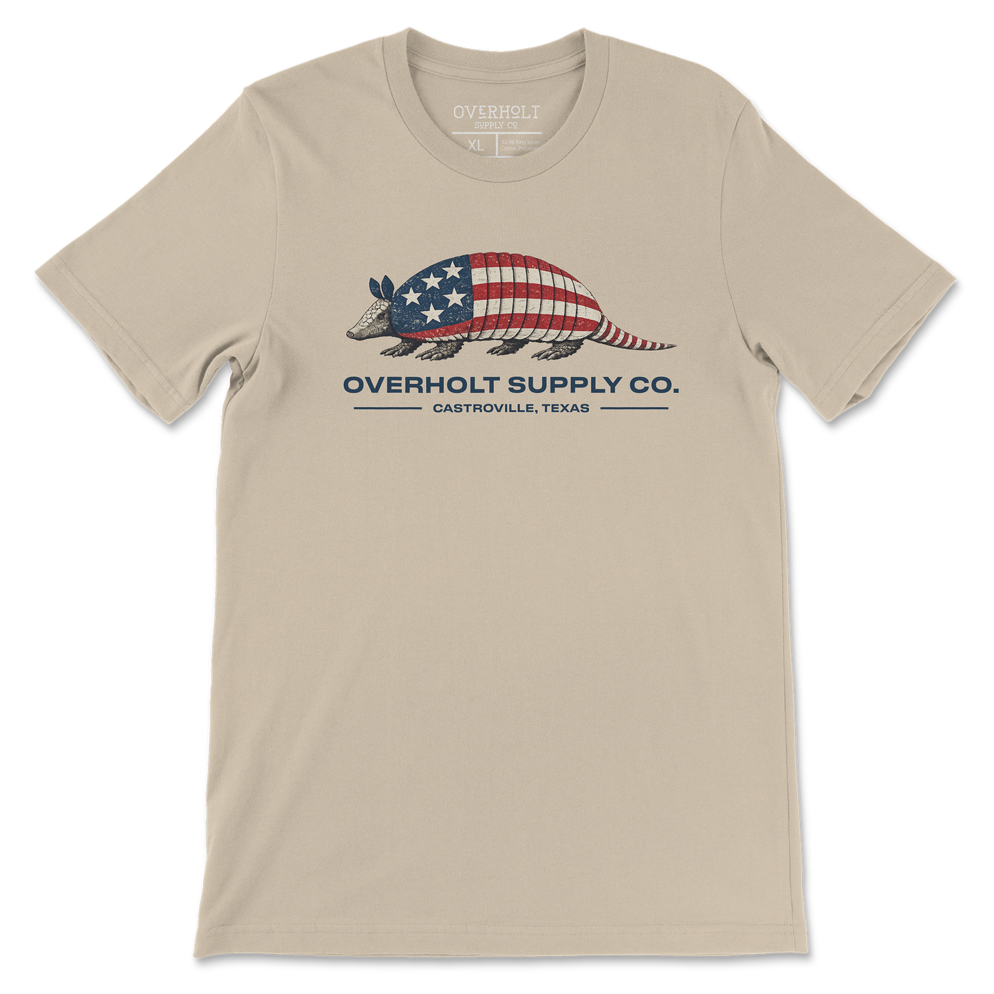 Americana armadillo graphic t-shirt on soft cream Bella and Canvas tee by Overholt Supply Co. featuring red, white, and blue design