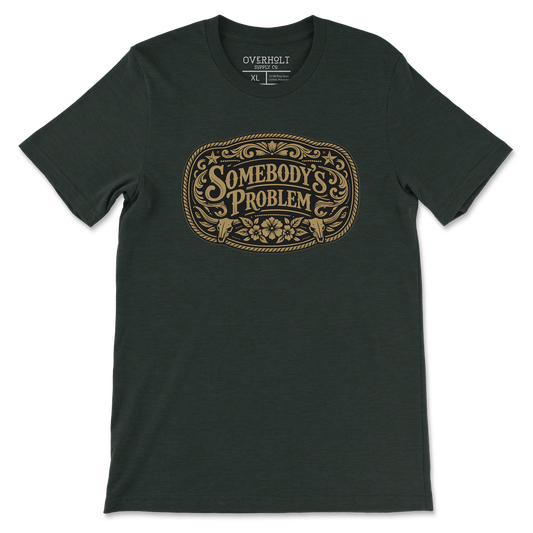 Somebody’s Problem t-shirt on heather emerald Bella and Canvas tee by Overholt Supply Co.